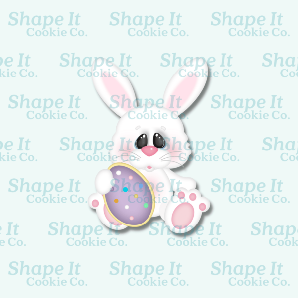 Bunny holding egg cookie cookie cutter image for Shape It Cookie Co.