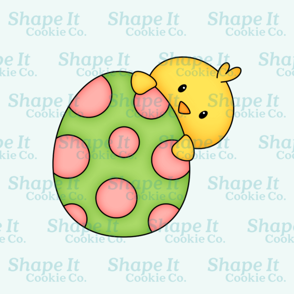 Cute chick hiding behind a green egg with pink dots cookie cutter image for Shape It Cookie Co.