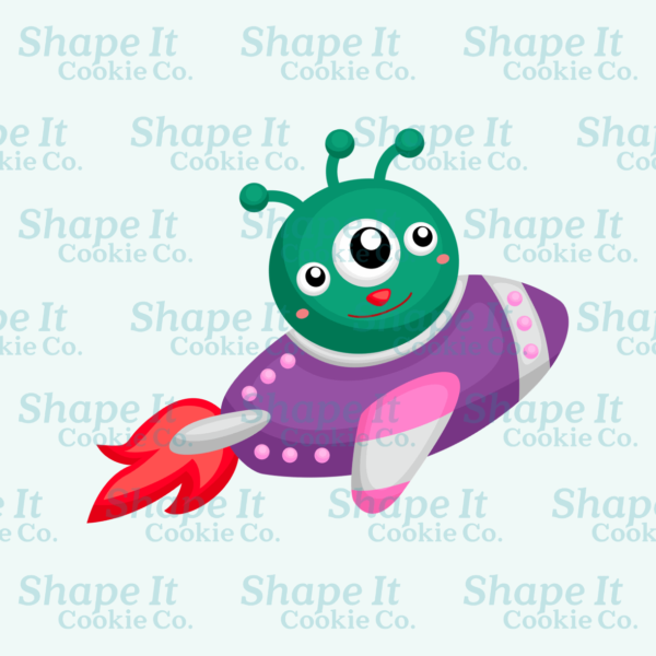 Three-eyed green alien riding purple rocket ship cookie cutter image for Shape It Cookie Co.